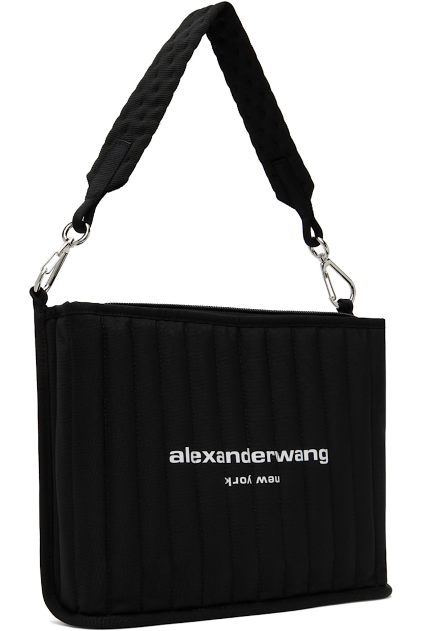 Padded and quilted nylon canvas shoulder bag in black. 

· Detachable shoulder strap
· Logo bonded at face
· Zip closure
· Patch pockets at interior 
· Silver-tone hardware
· H10" x W13.5" x D2.5"

Supplier color: Black
