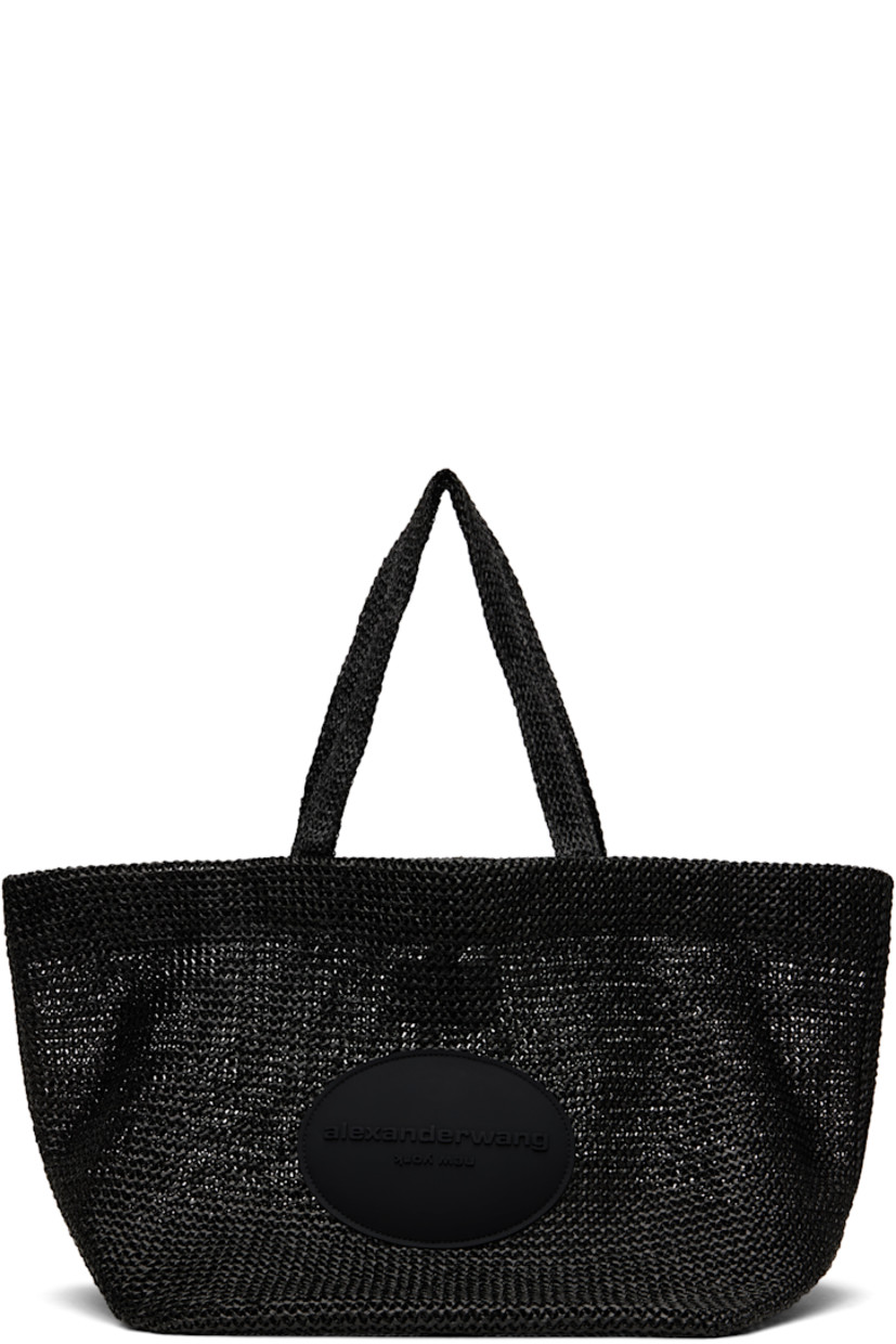 Woven faux-raffia tote in black. 

· Twin carry handles
· Rubberized logo patch at face
· Self-tie fastening at throat
· H13.5" x W25" x D12.5"

Supplier color: Black