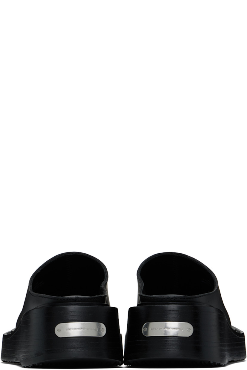 Buffed leather slip-on loafers in black.

· Square toe
· Logo plaque at heel
· Buffed leather lining
· Logo printed at padded leather footbed
· Stacked leather platform midsole
· Treaded rubber sole
· Platform: H2"

Supplier color: Black