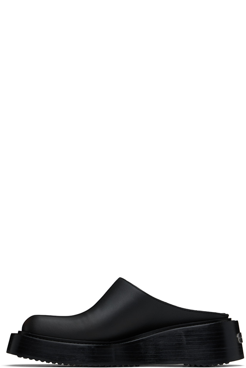 Buffed leather slip-on loafers in black.

· Square toe
· Logo plaque at heel
· Buffed leather lining
· Logo printed at padded leather footbed
· Stacked leather platform midsole
· Treaded rubber sole
· Platform: H2"

Supplier color: Black