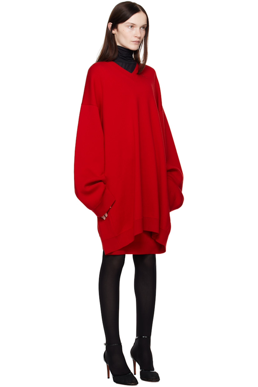 Knit wool minidress.

· Rib-knit V-neck, hem, and cuffs
· Dropped shoulders
· Twin inverted pleats at back

Supplier color: Red