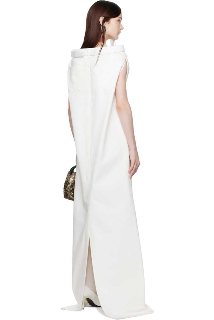 Non-stretch denim maxi dress.

· Belt loops at straight neck
· Detachable pin-buckle belt
· Five-pocket styling
· Zip-fly
· Central vent at back hem
· Raw edge at hem
· Unlined

Supplier color: Ivory