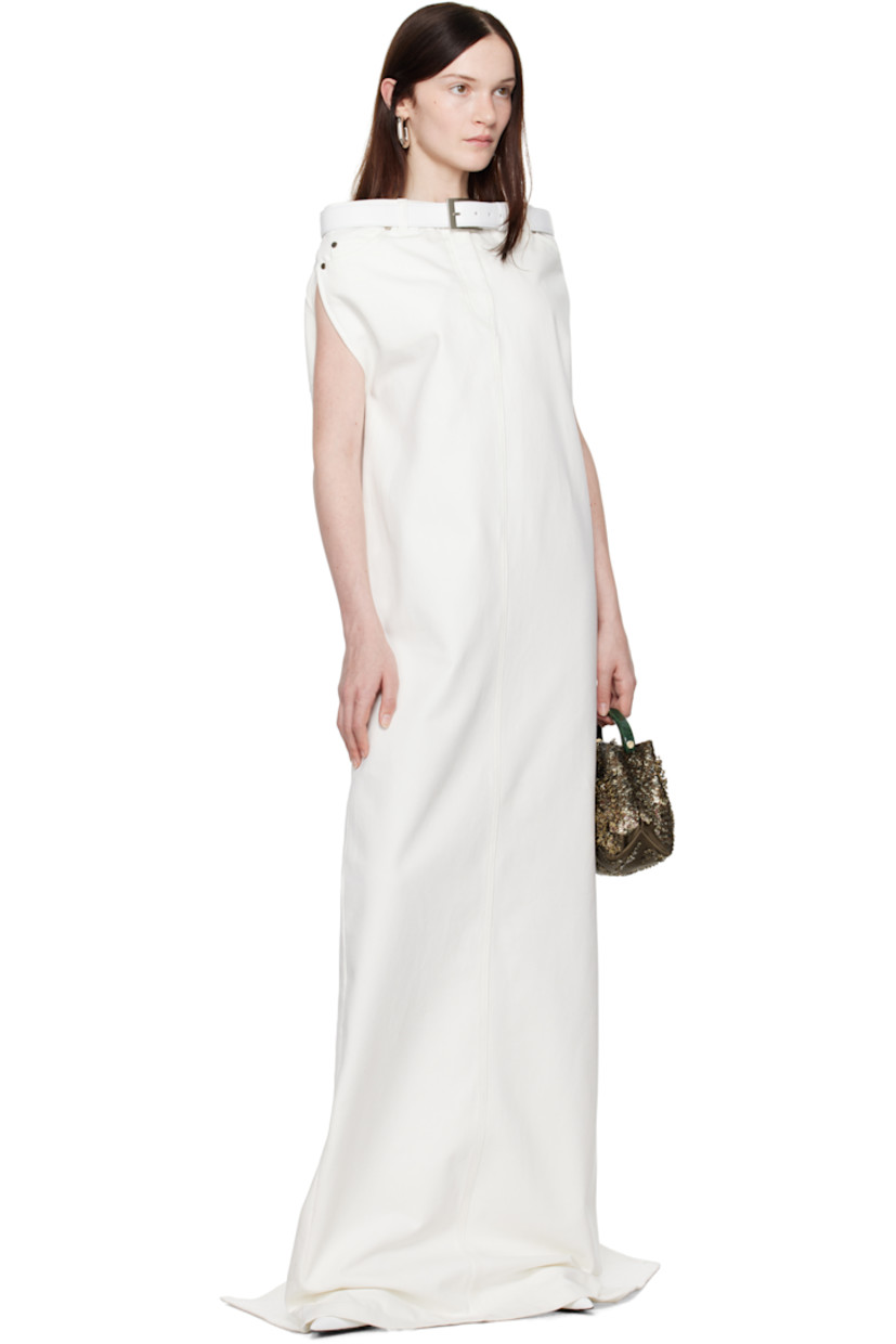 Non-stretch denim maxi dress.

· Belt loops at straight neck
· Detachable pin-buckle belt
· Five-pocket styling
· Zip-fly
· Central vent at back hem
· Raw edge at hem
· Unlined

Supplier color: Ivory