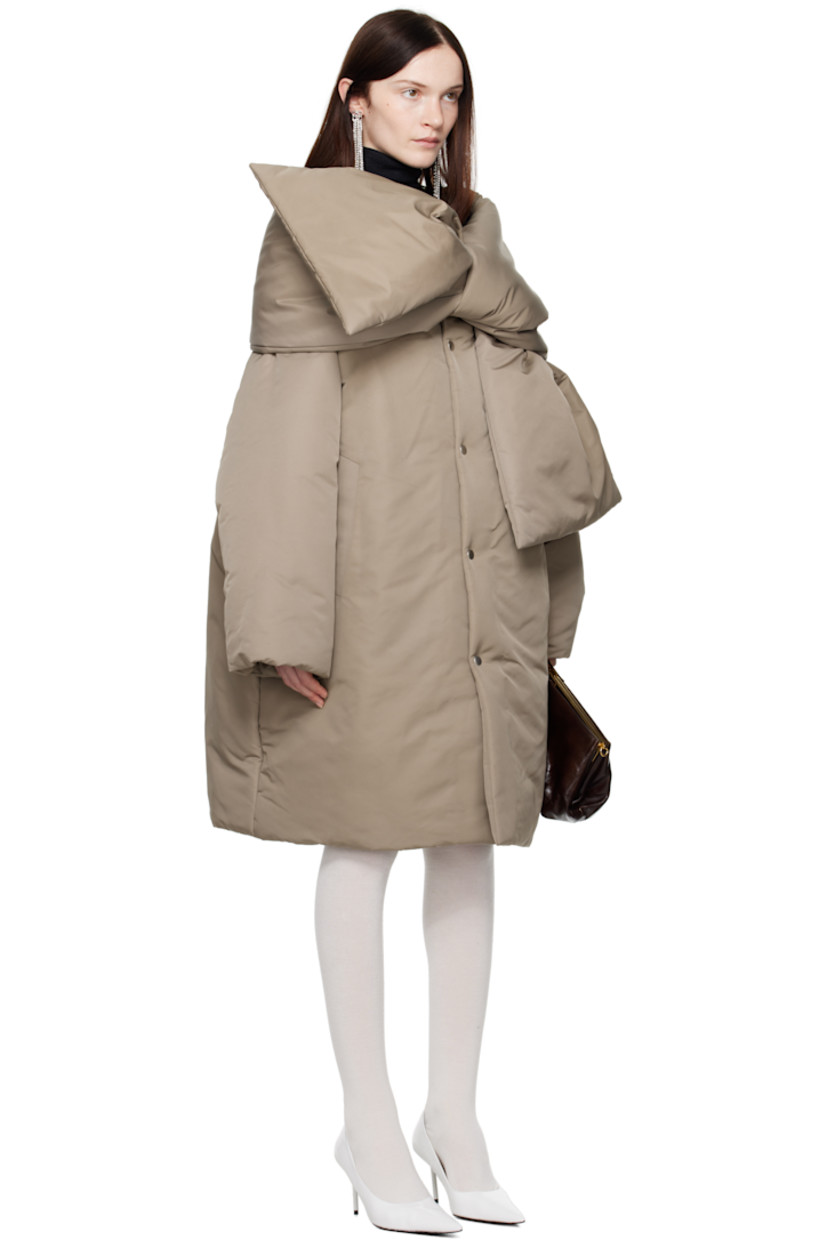 Insulated nylon taffeta jacket.

· Scarf-style panel at collar
· Press-stud closure
· Welt pockets
· Patch pocket at interior
· Fully lined

Supplier color: Stone grey