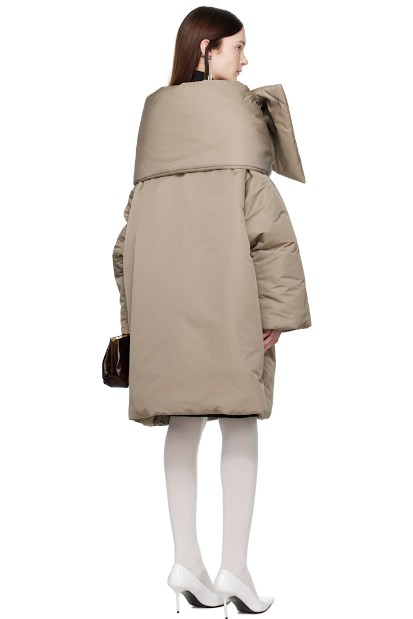 Insulated nylon taffeta jacket.

· Scarf-style panel at collar
· Press-stud closure
· Welt pockets
· Patch pocket at interior
· Fully lined

Supplier color: Stone grey