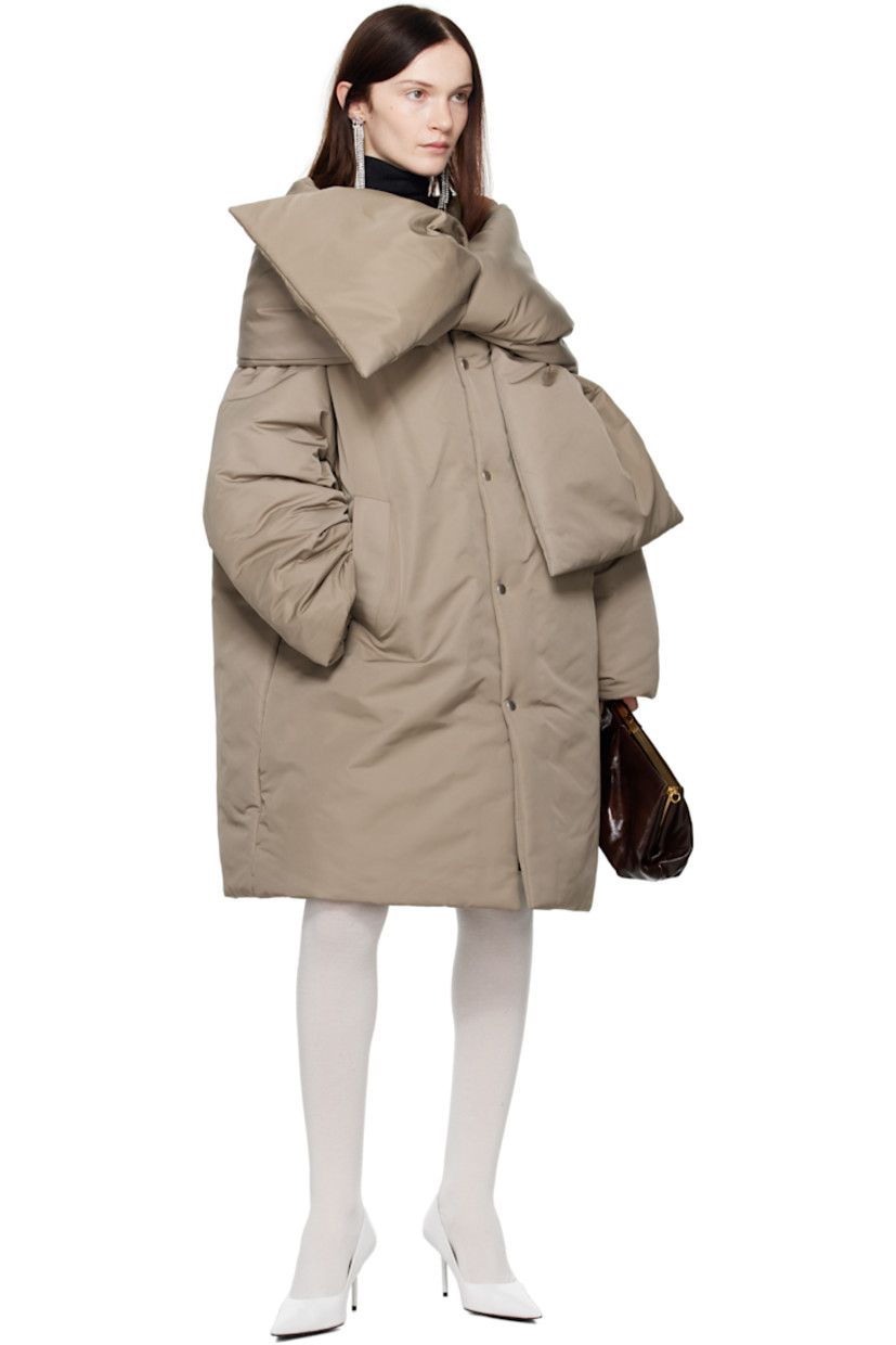 Insulated nylon taffeta jacket.

· Scarf-style panel at collar
· Press-stud closure
· Welt pockets
· Patch pocket at interior
· Fully lined

Supplier color: Stone grey