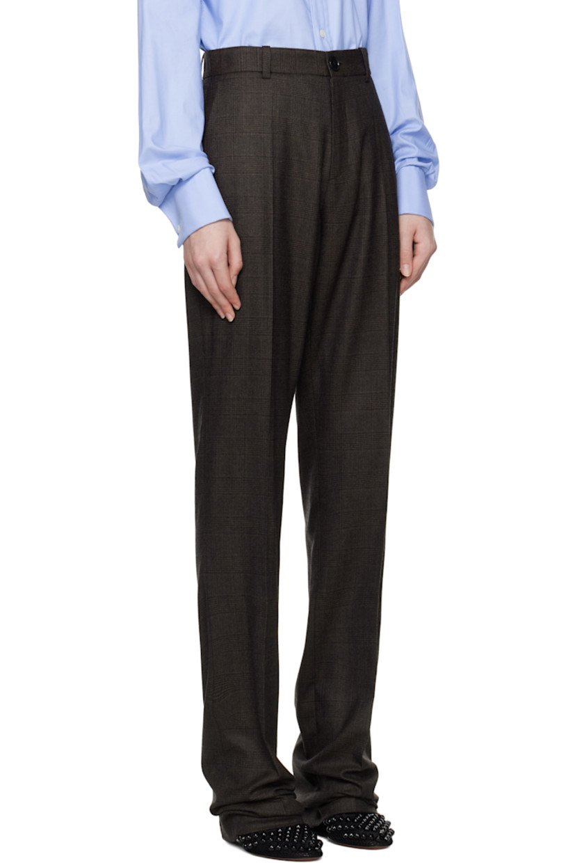 Woven wool trousers. Jacquard check pattern throughout.

· Slim-fit
· Belt loops
· Two-pocket styling
· Zip-fly
· Creased legs
· Darts at back waist
· Partial cupro satin lining

Supplier color: Brown check