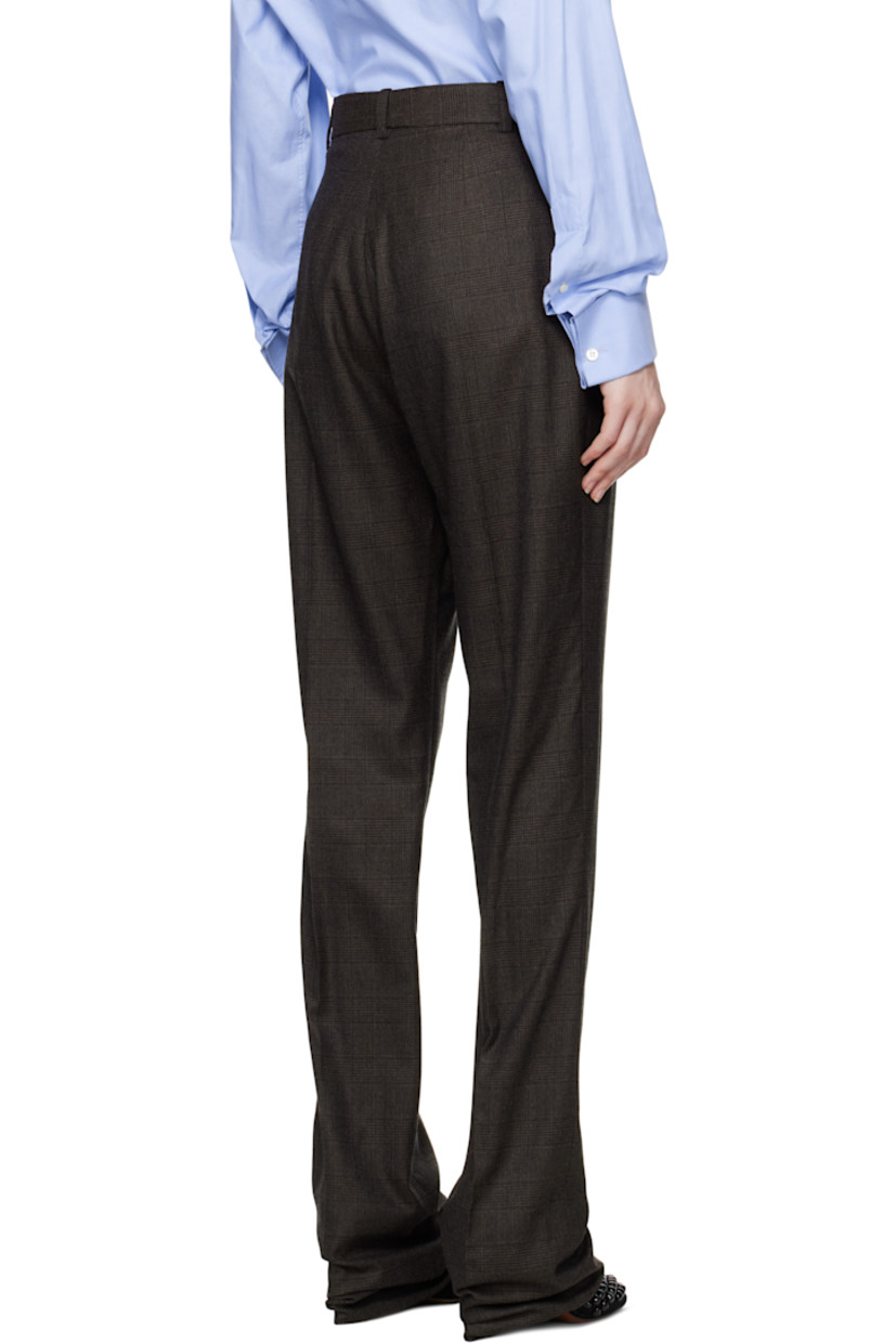 Woven wool trousers. Jacquard check pattern throughout.

· Slim-fit
· Belt loops
· Two-pocket styling
· Zip-fly
· Creased legs
· Darts at back waist
· Partial cupro satin lining

Supplier color: Brown check