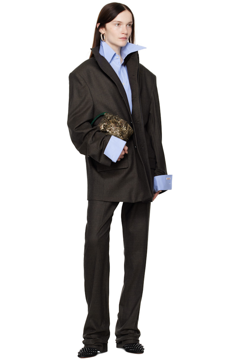 Woven wool trousers. Jacquard check pattern throughout.

· Slim-fit
· Belt loops
· Two-pocket styling
· Zip-fly
· Creased legs
· Darts at back waist
· Partial cupro satin lining

Supplier color: Brown check