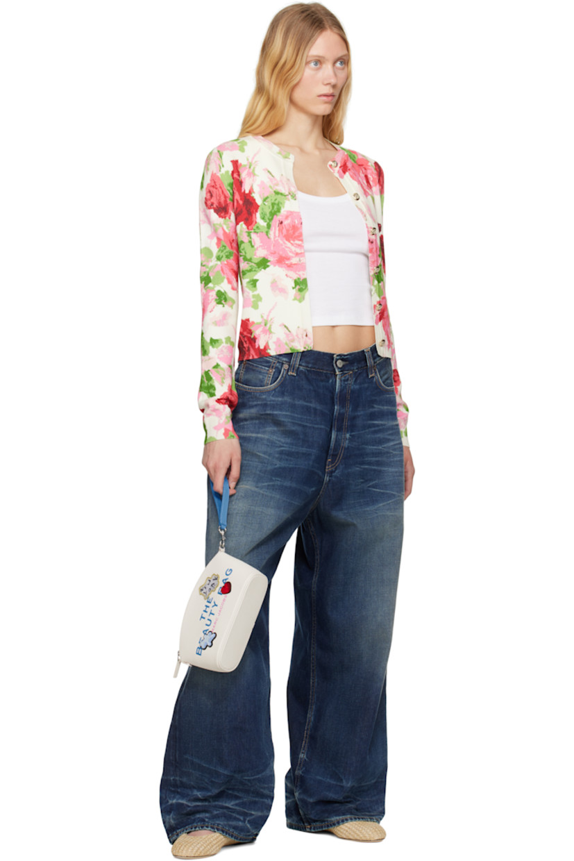 Pebbled leather cosmetic pouch in white.

· Detachable wristlet strap
· Text and logo printed at face
· Chenille and graphic patches 
· Logo patch at back face
· Zip closure
· Twill lining
· H5.25" x W8" x D3"

Supplier color: White/Multi