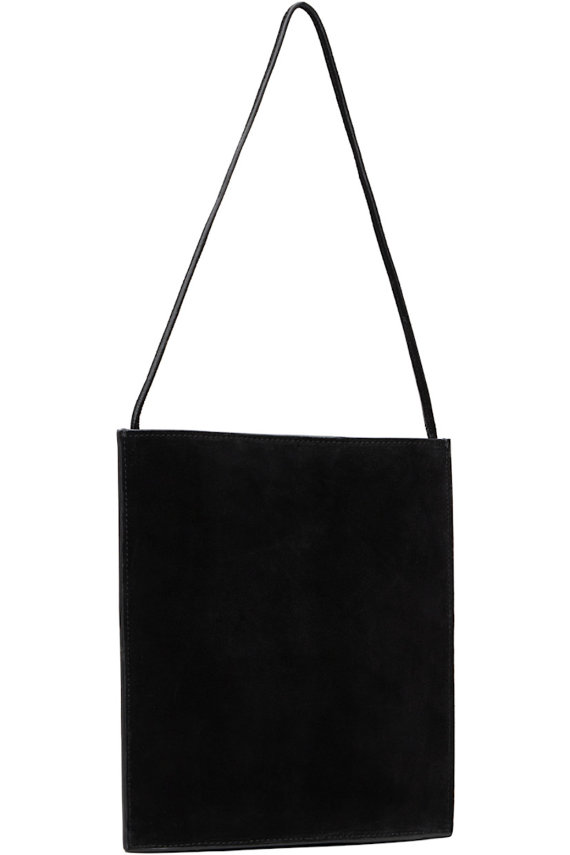 Calfskin suede shoulder bag in black.

· Fixed shoulder strap
· Logo stamp at face
· Magnetic closure
· Suede lining
· H9" x W8.25" x D1.75"

Supplier color: Black