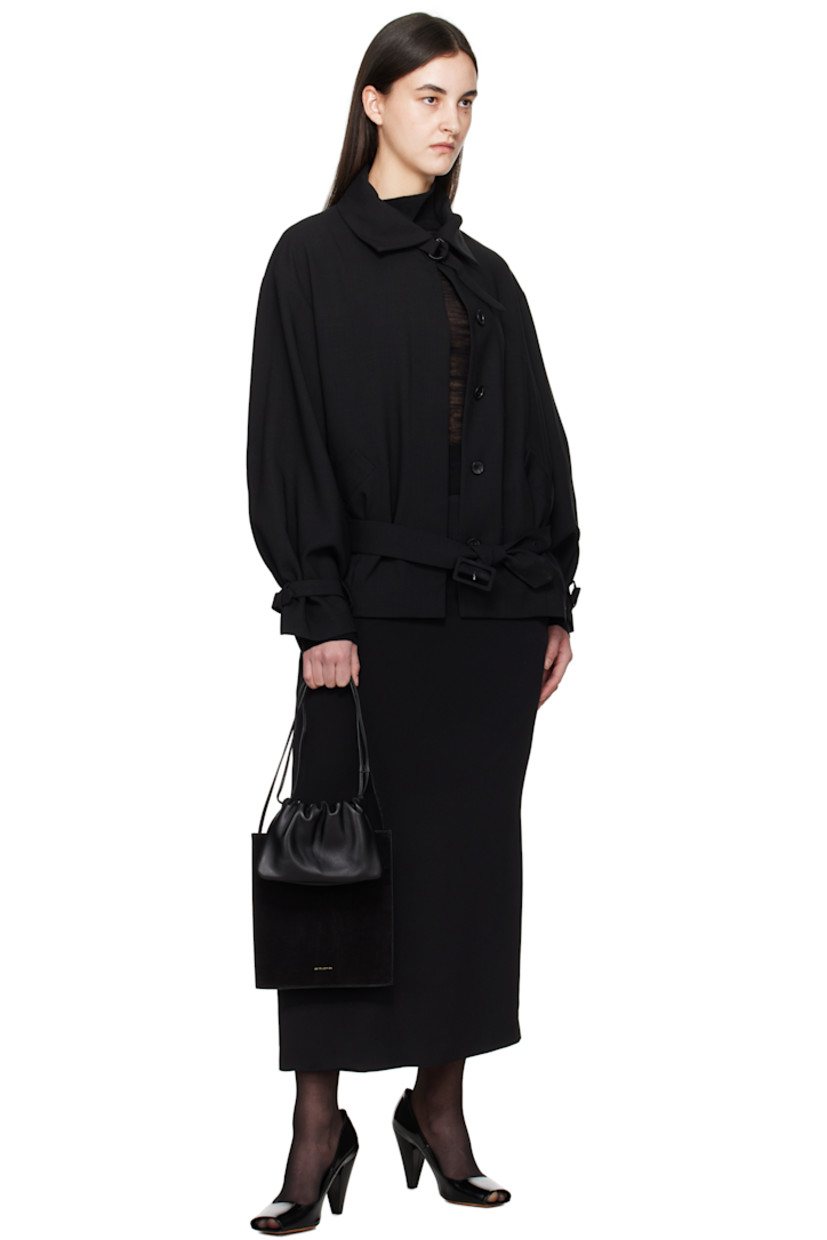 Calfskin suede shoulder bag in black.

· Fixed shoulder strap
· Logo stamp at face
· Magnetic closure
· Suede lining
· H9" x W8.25" x D1.75"

Supplier color: Black