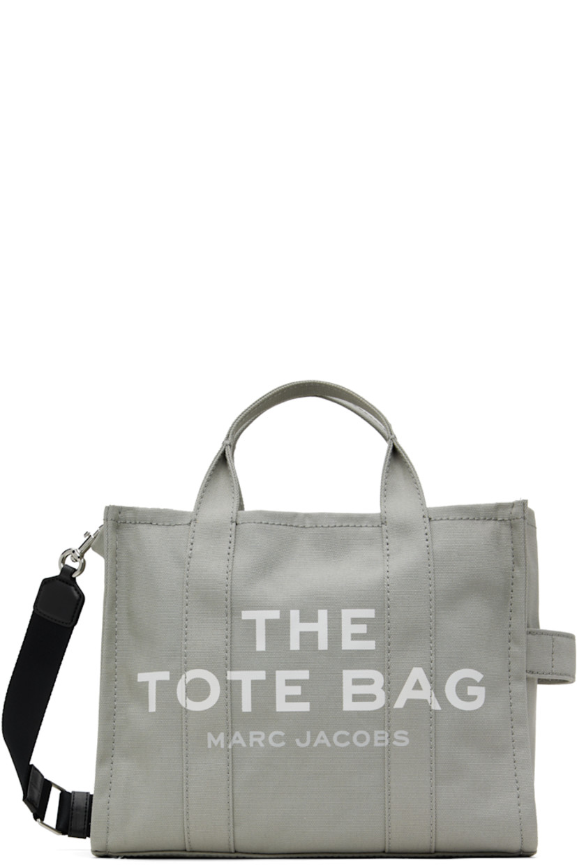 Cotton canvas tote in gray.

· Twin rolled carry handles
· Adjustable and detachable webbing crossbody strap
· Logo printed at face
· Carry handle at side
· Logo patch at back face
· Zip closure
· Zip pocket and patch pockets at interior
· Unlined
· Logo-engraved silver-tone hardware
· H11" x W13" x D6"

Supplier color: Wolf Grey