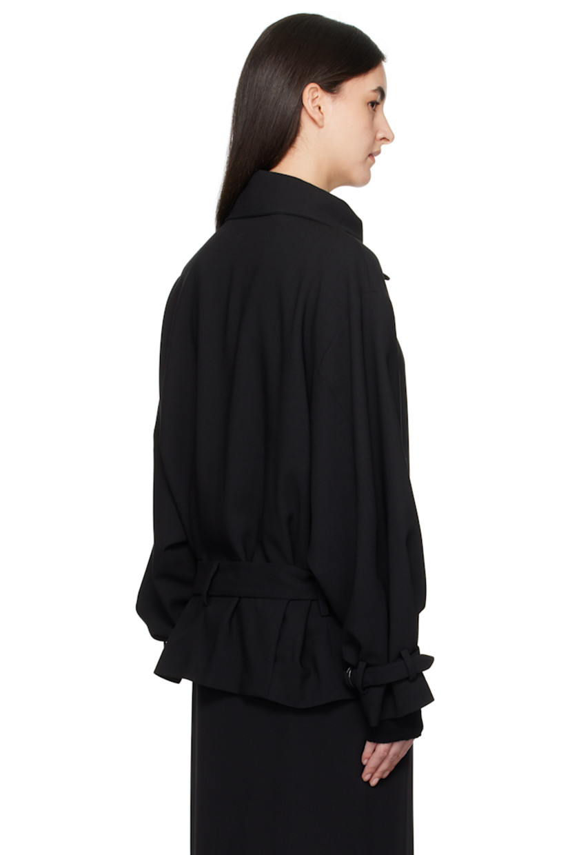 Virgin wool twill jacket. 

· Detachable cinch fastening at spread collar
· Concealed button closure
· Belt loops and detachable pin-buckle belt
· Welt pockets
· Tucks at front hem
· Adjustable cinch tab at cuffs
· Welt pockets at interior
· Full silk satin lining

Supplier color: Black
