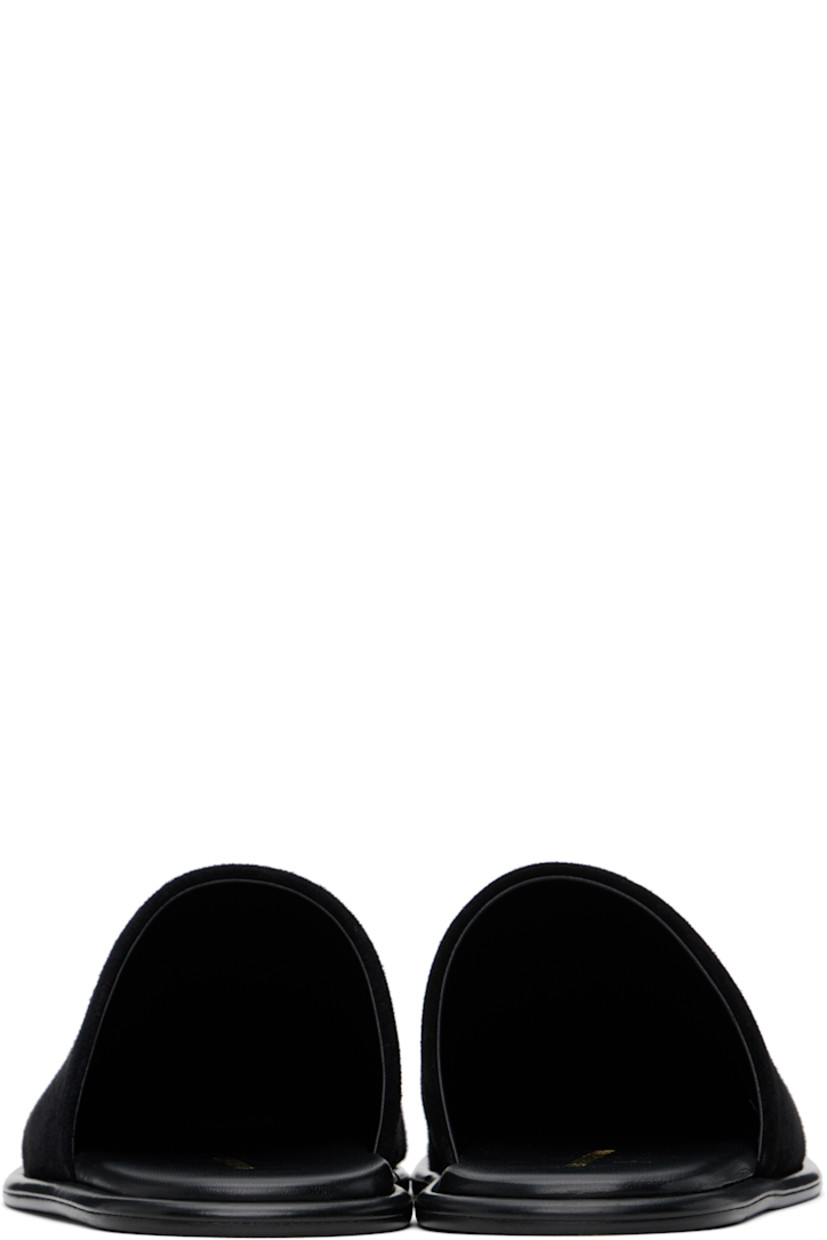 Suede slippers in black.

· Square toe
· Logo stamp at padded footbed
· Leather sole with rubber injections

Supplier color: Black