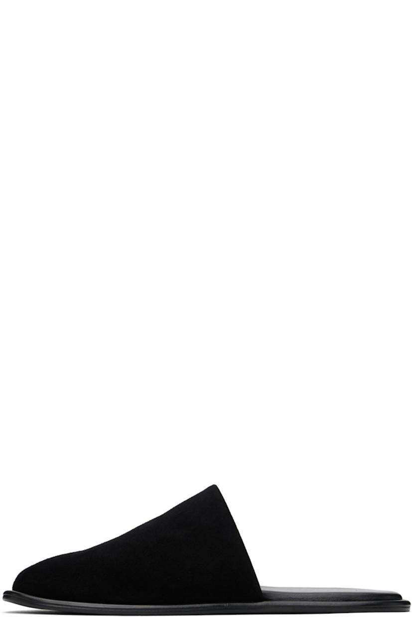 Suede slippers in black.

· Square toe
· Logo stamp at padded footbed
· Leather sole with rubber injections

Supplier color: Black