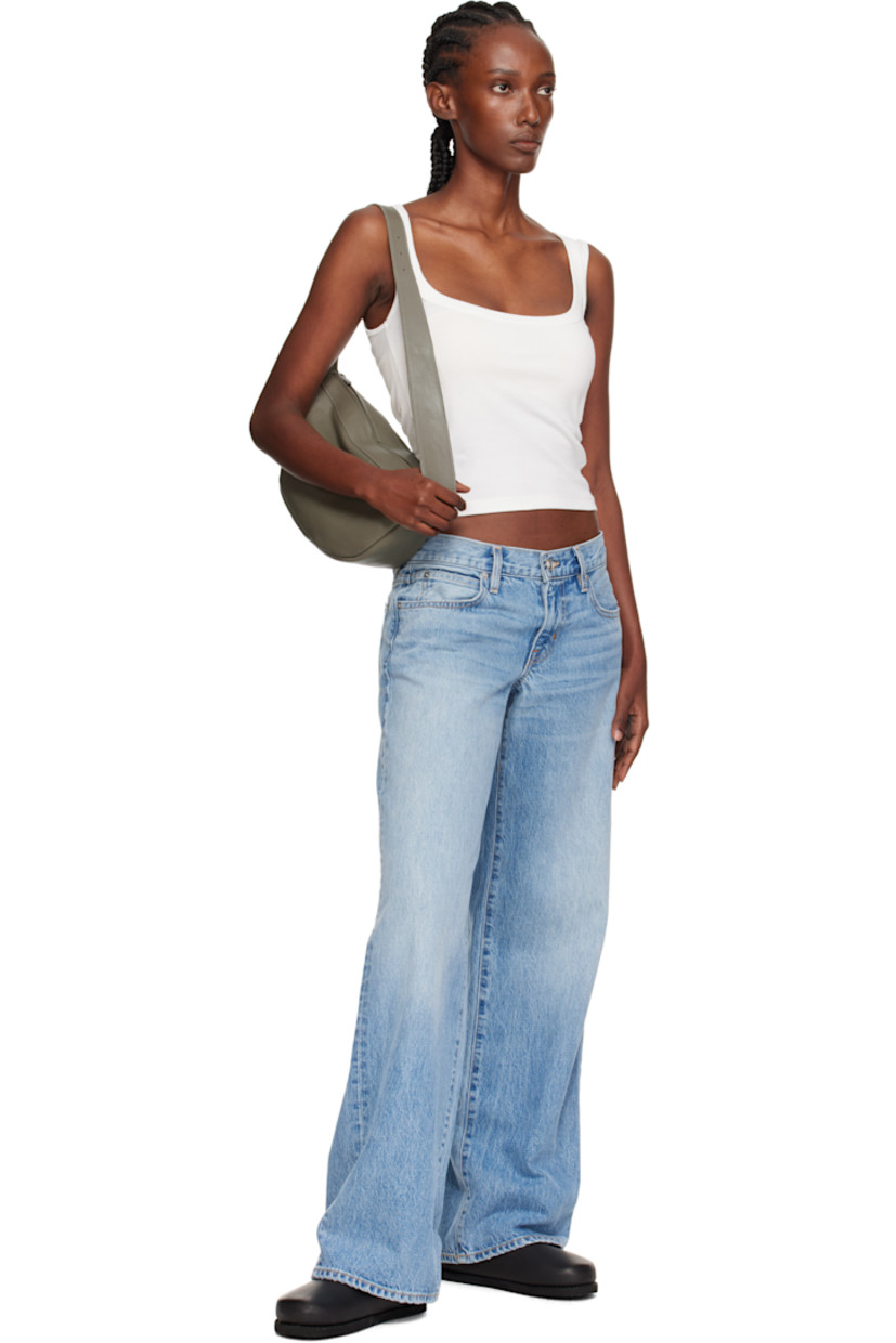 Vegetable-tanned buffed leather shoulder bag.

· LWG-certified leather
· Adjustable pin-buckle shoulder strap
· Zip closure
· Goatskin suede lining
· H7" x W13" x D3.5"

Supplier color: Slate
