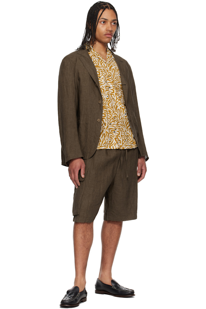 Yarn-dyed linen hopsack blazer.

· Notched lapel
· Button closure
· Patch pockets
· Unlined

Supplier color: Brown
