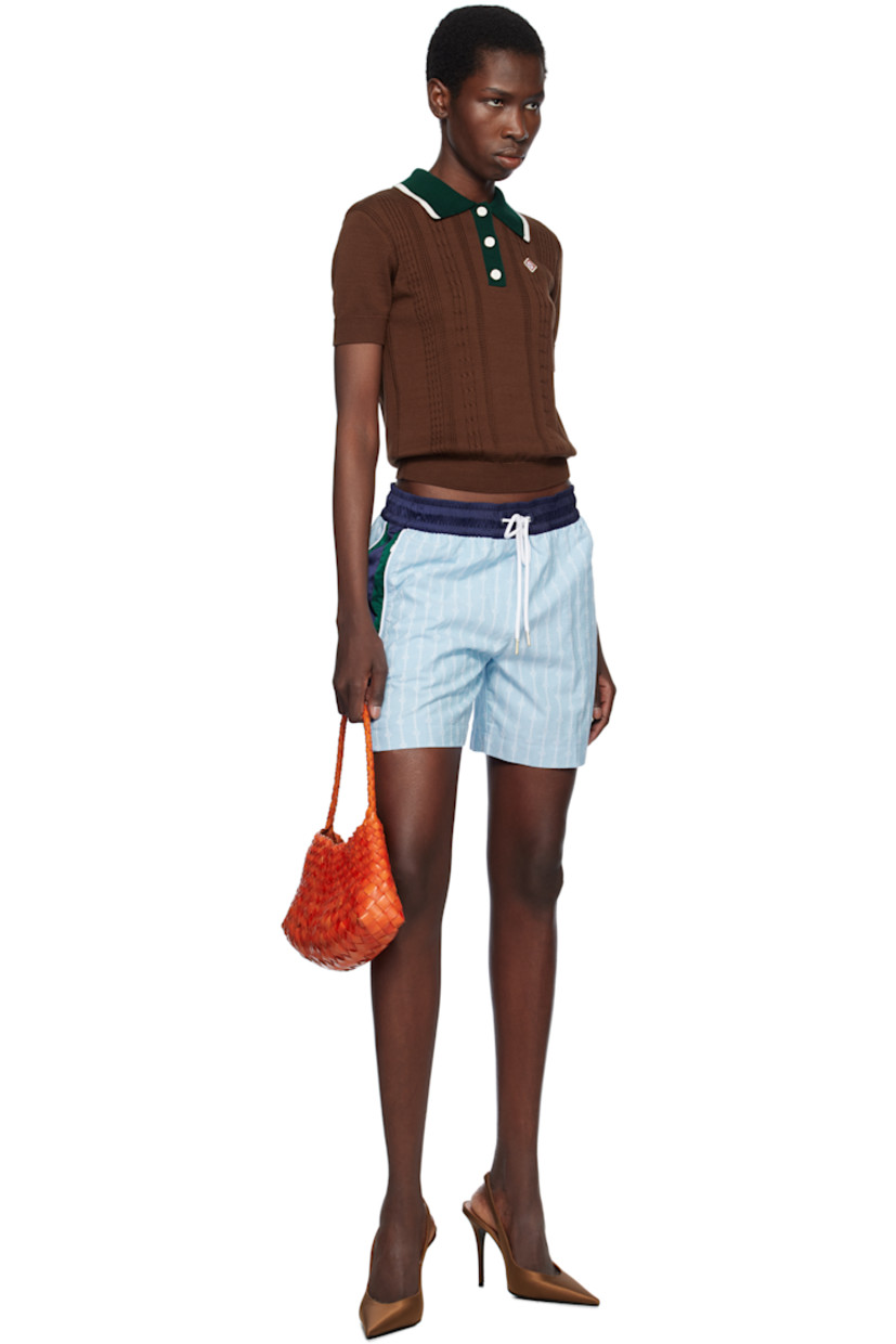 Cotton-blend canvas shorts. Jacquard logo graphic pattern and satin trim throughout.

· Paneled construction
· Drawstring at elasticized waistband
· Three-pocket styling
· Embroidered logo patch at front
· Stripes at outseams
· Full recycled polyester mesh lining
· Gold-tone hardware

Supplier color: Blue