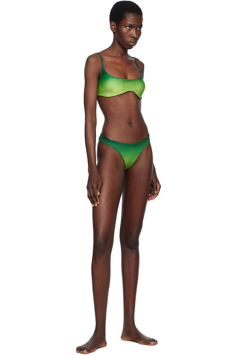 Stretch polyester jersey bikini top. Gradient printed throughout.

· Scoop neck
· Removable padding and dart at cups
· Anti-slip silicone trim at hem
· Logo hardware at side and back
· Adjustable spaghetti straps
· Full stretch jersey lining

Supplier color: Green
