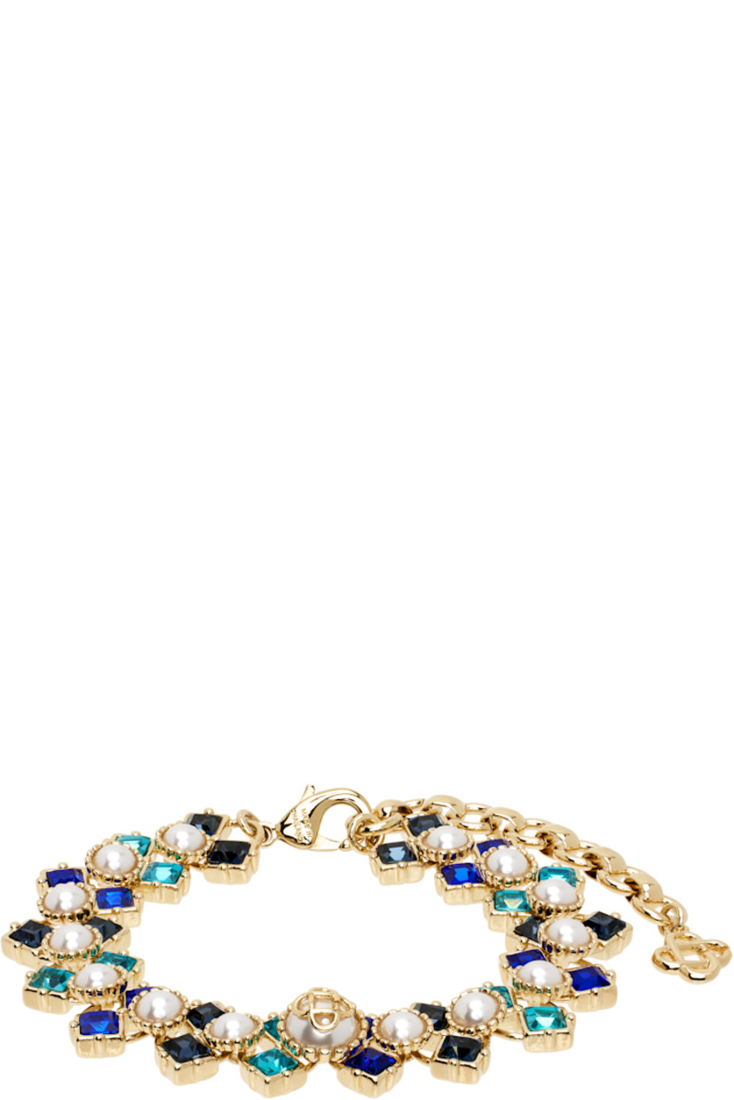 Modified cup chain bracelet in gold-tone brass.

· Faux-pearls and blue crystals at length
· Logo charm at adjustable lobster-clasp fastening
· L8"

Supplier color: Gold/Blue