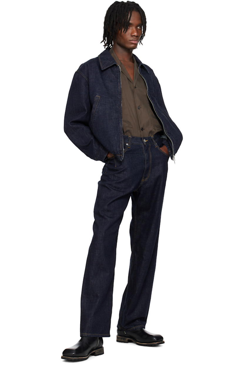 Non-stretch denim jacket. 

· Spread collar
· Two-way zip closure
· Welt pockets
· Elasticized hem
· Single-button barrel cuffs
· Logo-engraved silver-tone hardware
· Contrast stitching in tan

Supplier color: Indigo