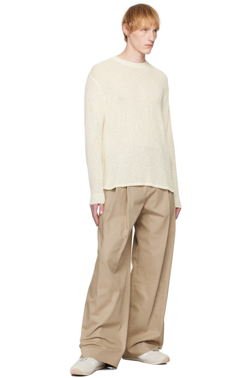 Open-knit cotton sweater. 

· Rib-knit crewneck, hem, and cuffs
· Dropped shoulders
· Rib-knit trim at shoulder seams 

Supplier color: Off-white