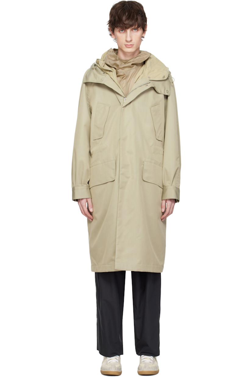 Water-repellent cotton- and polyester-blend twill coat. Includes detachable nylon taffeta liner.

· Bungee-style drawstring at hood
· Zip closure with press-stud placket
· Flap pockets
· Concealed bungee-style drawstring at waist
· Raglan sleeves
· Adjustable press-stud barrel cuffs 
· Welt pockets at interior 
· Full nylon satin lining
· Logo-engraved silver-tone hardware

Supplier color: Beige