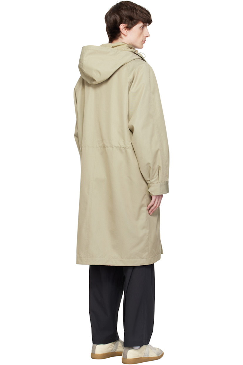 Water-repellent cotton- and polyester-blend twill coat. Includes detachable nylon taffeta liner.

· Bungee-style drawstring at hood
· Zip closure with press-stud placket
· Flap pockets
· Concealed bungee-style drawstring at waist
· Raglan sleeves
· Adjustable press-stud barrel cuffs 
· Welt pockets at interior 
· Full nylon satin lining
· Logo-engraved silver-tone hardware

Supplier color: Beige