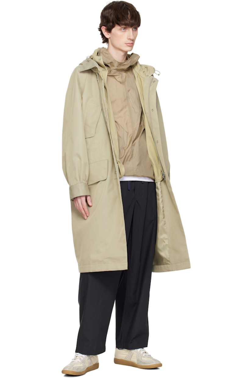 Water-repellent cotton- and polyester-blend twill coat. Includes detachable nylon taffeta liner.

· Bungee-style drawstring at hood
· Zip closure with press-stud placket
· Flap pockets
· Concealed bungee-style drawstring at waist
· Raglan sleeves
· Adjustable press-stud barrel cuffs 
· Welt pockets at interior 
· Full nylon satin lining
· Logo-engraved silver-tone hardware

Supplier color: Beige