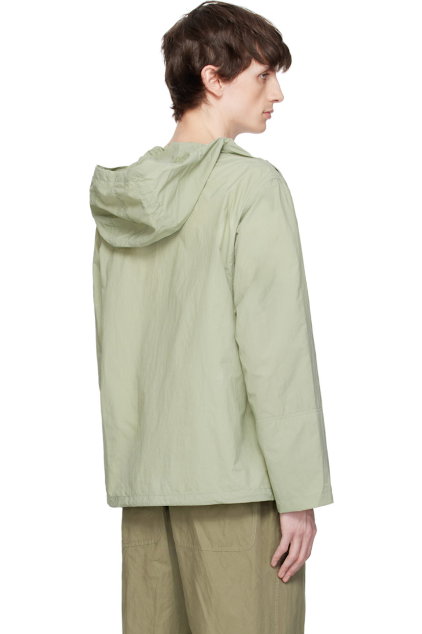 Nylon taffeta jacket. 

· Bungee-style drawstring at hood and hem
· Button fastening at funnel neck extends to shoulder
· Patch pocket and welt pockets
· Concealed elasticized cuffs
· Unlined 

Supplier color: Olive