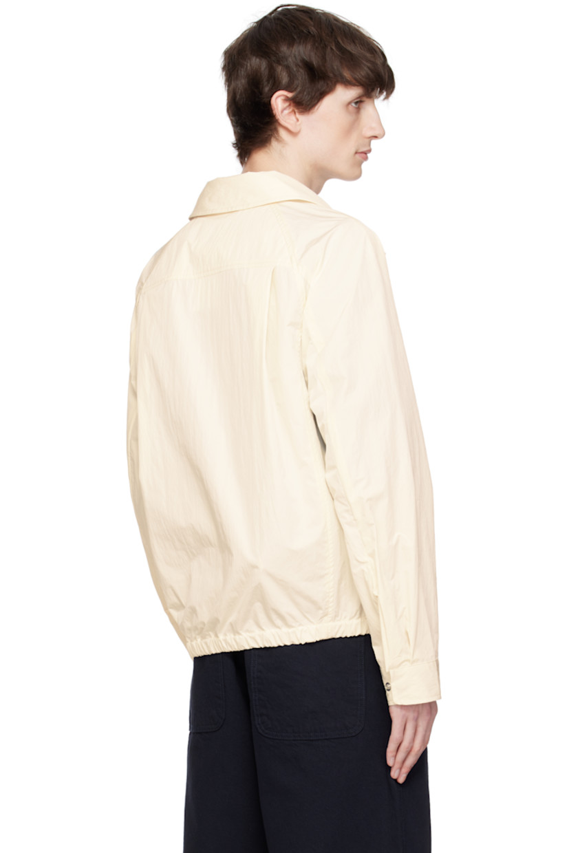 Water-repellent coated cotton- and nylon-blend taffeta jacket. 

· Spread collar
· Two-way zip closure
· Patch pocket and seam pockets
· Partially elasticized hem
· Raglan sleeves
· Press-stud barrel cuffs
· Twin pleats at back yoke
· Patch pockets at interior
· Unlined

Supplier color: Ivory