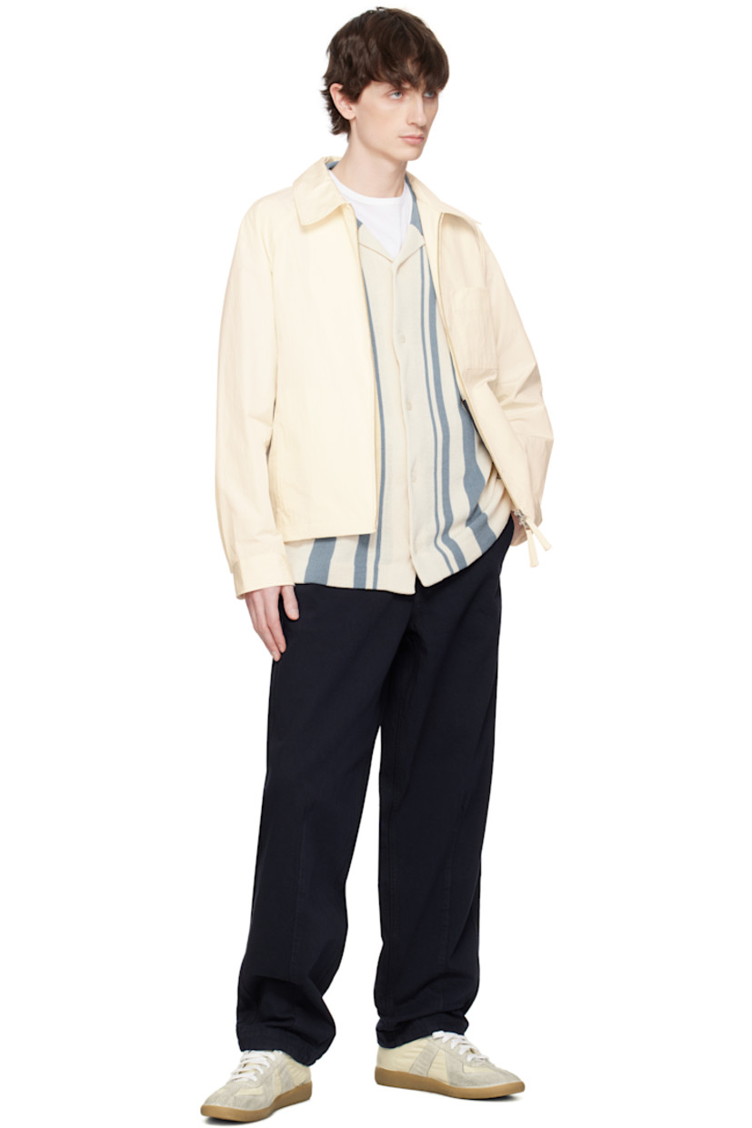 Water-repellent coated cotton- and nylon-blend taffeta jacket. 

· Spread collar
· Two-way zip closure
· Patch pocket and seam pockets
· Partially elasticized hem
· Raglan sleeves
· Press-stud barrel cuffs
· Twin pleats at back yoke
· Patch pockets at interior
· Unlined

Supplier color: Ivory