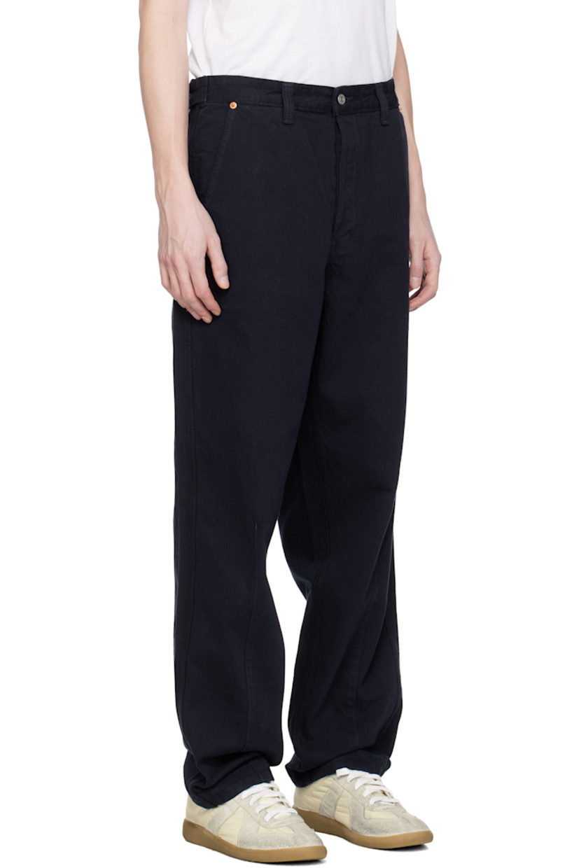 Non-stretch denim jeans. 

· Belt loops
· Four-pocket styling
· Button fly
· Darts at legs
· Adjustable button tabs at back waistband
· Leather logo patch and textile logo patch at back
· Logo-engraved bronze- and silver-tone hardware

Supplier color: Navy
