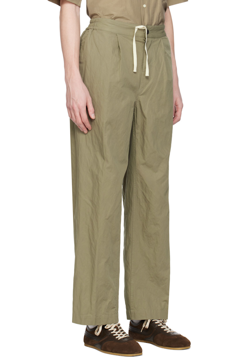 Garment-washed cotton-blend twill trousers. 

· Drawstring at elasticized waistband 
· Four-pocket styling
· Button fly
· Pleats at front waistband
· Logo patch at back waistband

Supplier color: Khaki