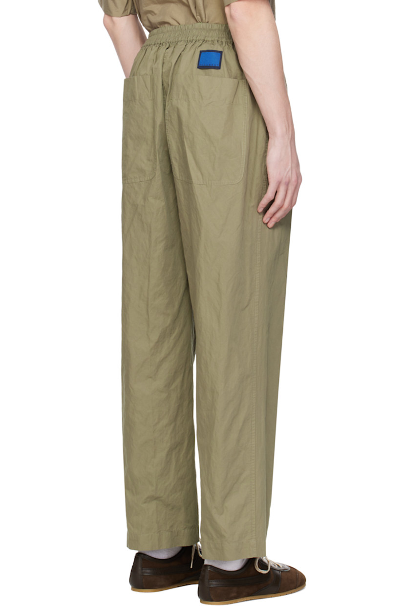 Garment-washed cotton-blend twill trousers. 

· Drawstring at elasticized waistband 
· Four-pocket styling
· Button fly
· Pleats at front waistband
· Logo patch at back waistband

Supplier color: Khaki