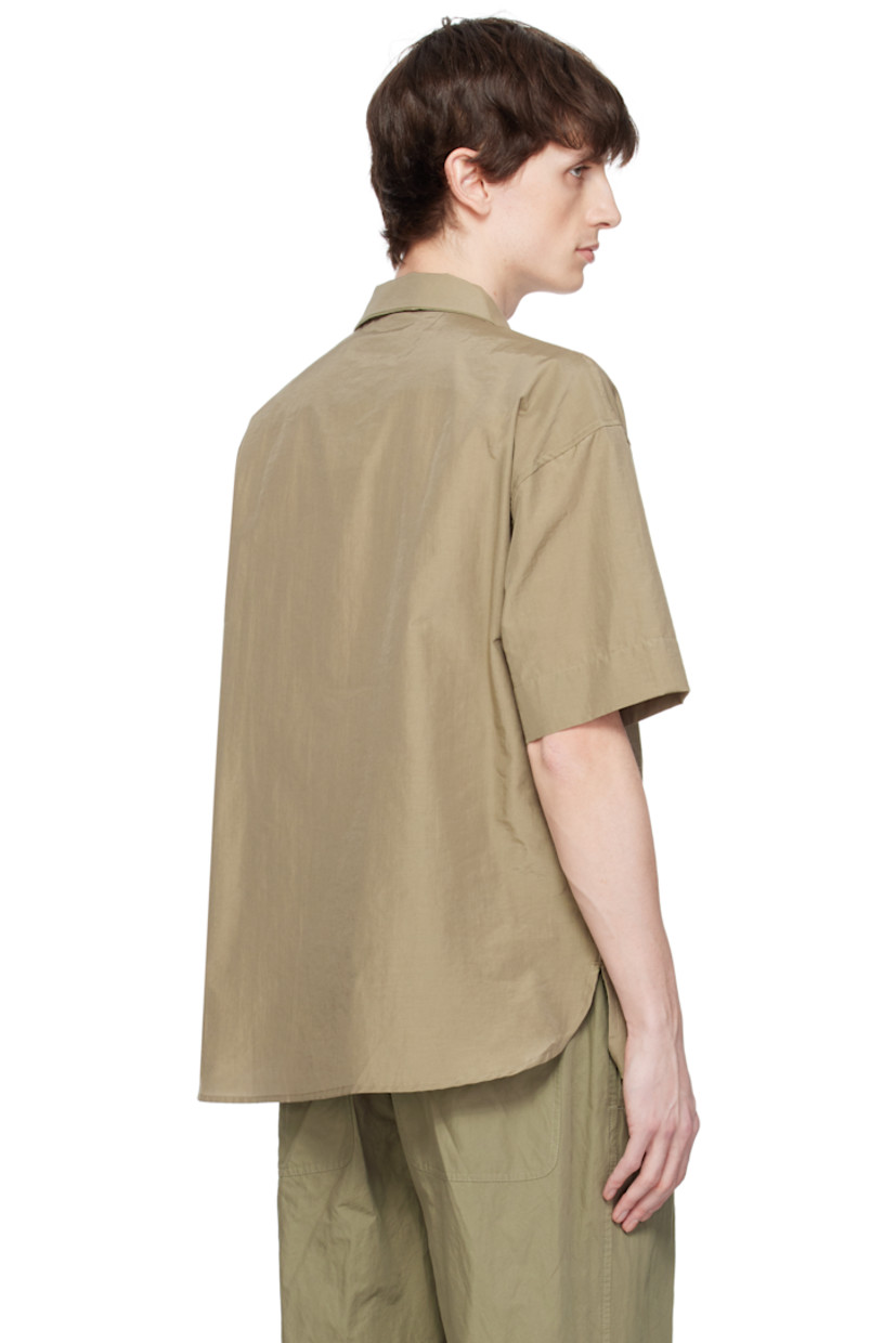 Cotton- and polyester-blend poplin shirt.

· Spread collar
· Button closure 
· Patch pocket and welt pockets
· Shirttail hem 
· Vented side seams
· Gathering at shoulders

Supplier color: Olive