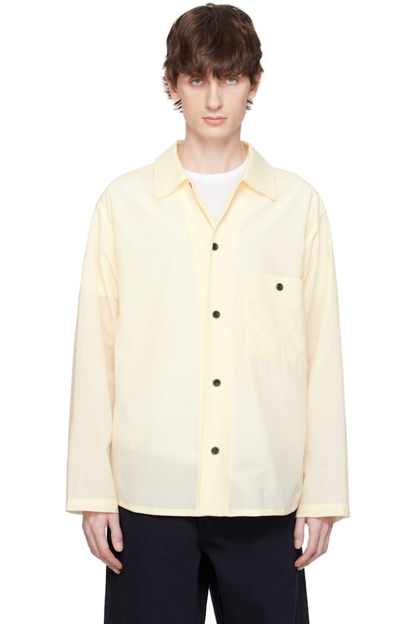 Semi-sheer cotton- and polyester-blend broadcloth shirt. 

· Spread collar
· Button closure
· Patch pocket
· Shirttail hem
· Twin pleats at back yoke 
· Horn hardware

Supplier color: Ivory