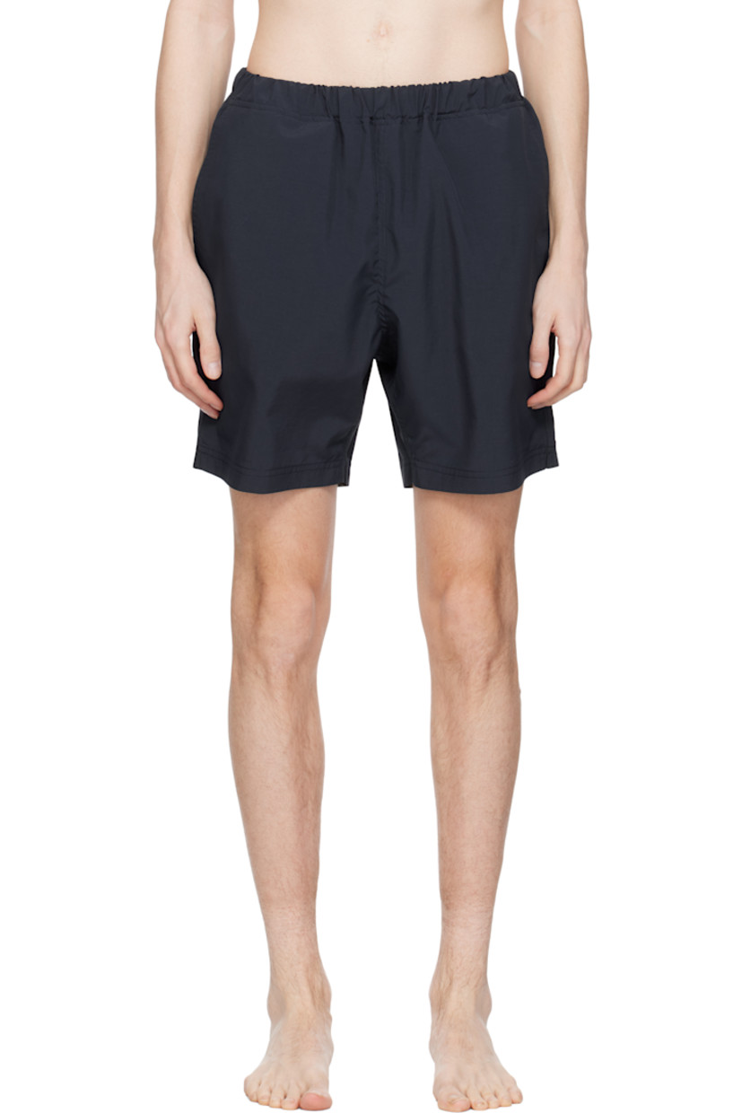 Taffeta swim shorts. 

· Concealed drawstring at elasticized waistband
· Three-pocket styling
· Logo patch at back waistband
· Partial mesh lining 

Supplier color: Navy