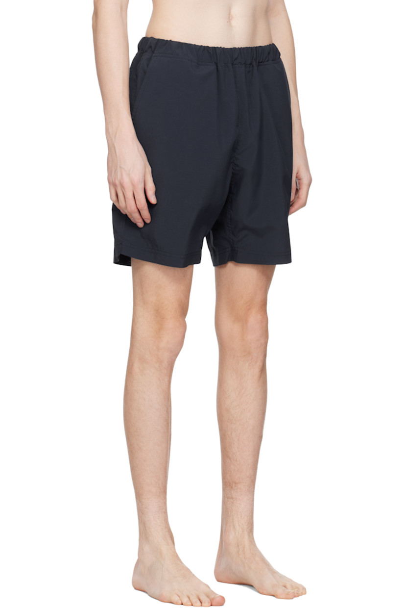 Taffeta swim shorts. 

· Concealed drawstring at elasticized waistband
· Three-pocket styling
· Logo patch at back waistband
· Partial mesh lining 

Supplier color: Navy