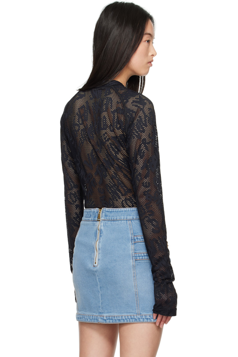 Sheer stretch nylon fishnet T-shirt. Jacquard logo pattern throughout. 

· Mock neck
· Logo patch at front hem
· Raglan sleeves
· Thumbhole at cuffs

Supplier color: Black