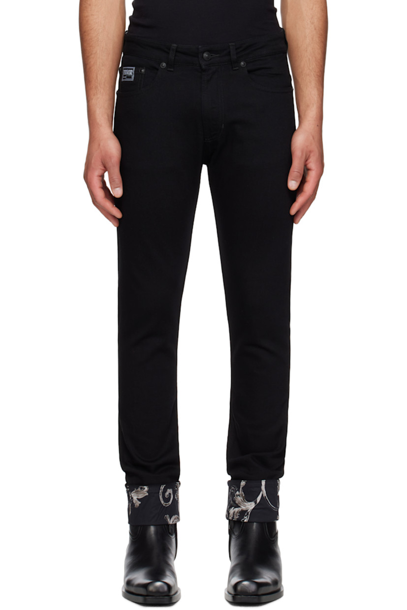 Stretch denim jeans. 

· Belt loops
· Five-pocket styling
· Zip fly
· Embroidered logo patch at coin pocket
· Rolled cuffs
· Graphic pattern printed at cuffs and back pockets
· Leather logo patch at back waistband
· Logo-engraved hardware

Supplier color: Black