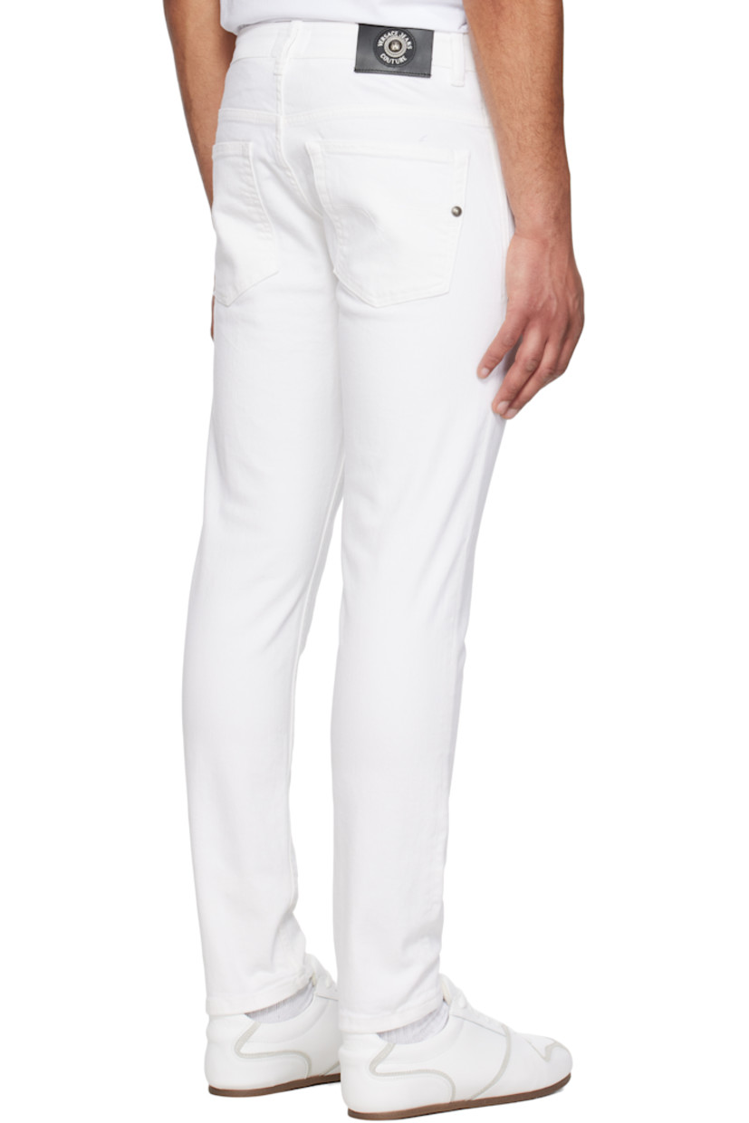 Stretch denim jeans. 

· Belt loops
· Five-pocket styling
· Zip fly
· Embroidered logo patch at coin pocket
· Leather logo patch at back waistband
· Logo-engraved silver-tone hardware

Supplier color: White