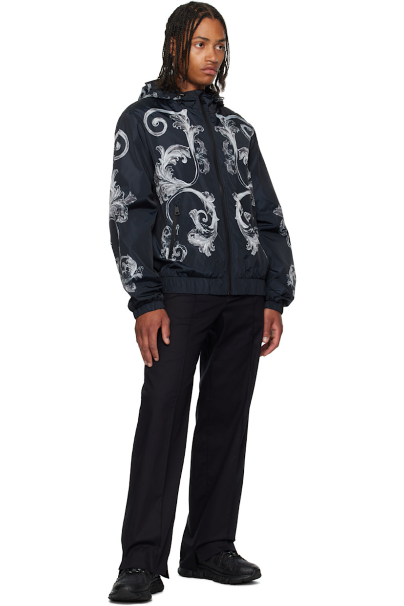 Stretch cotton twill trousers.

· Straight-leg
· Jacquard logo pattern at elasticized waistband
· Four-pocket styling
· Zip fly
· Pinched seam at front legs
· Vents at cuffs
· Creased seam at back legs

Supplier color: Black+Print