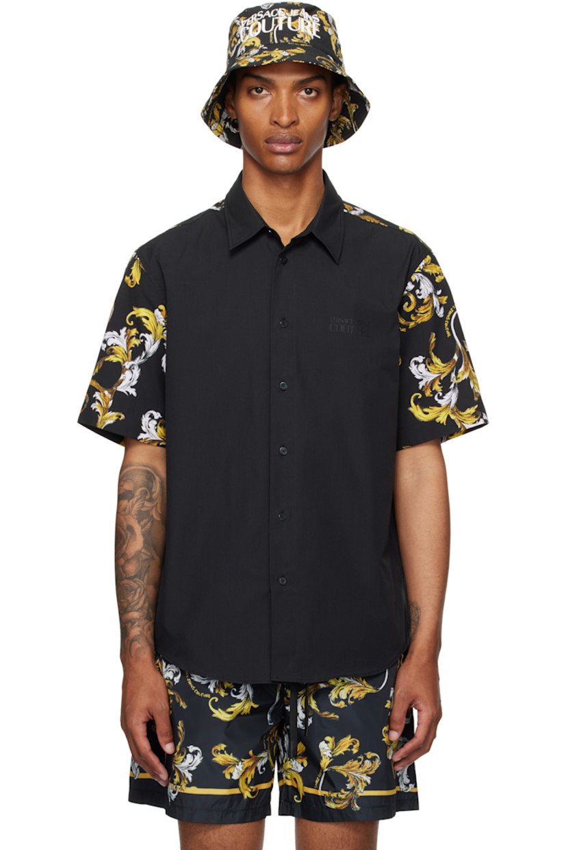 Cotton poplin shirt.

· Spread collar
· Button closure
· Logo bonded at chest
· Shirttail hem
· Barocco pattern printed at sleeves and back yoke

Supplier color: Black/Gold
