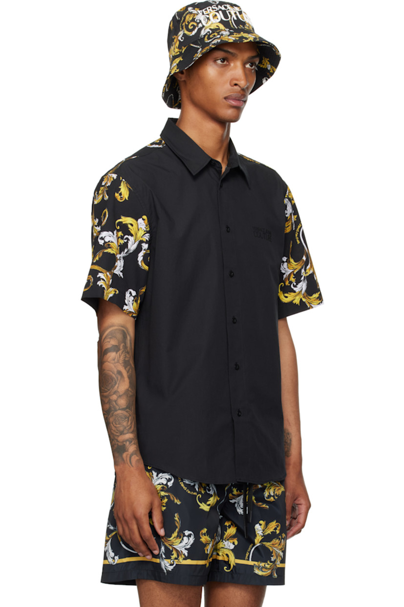 Cotton poplin shirt.

· Spread collar
· Button closure
· Logo bonded at chest
· Shirttail hem
· Barocco pattern printed at sleeves and back yoke

Supplier color: Black/Gold