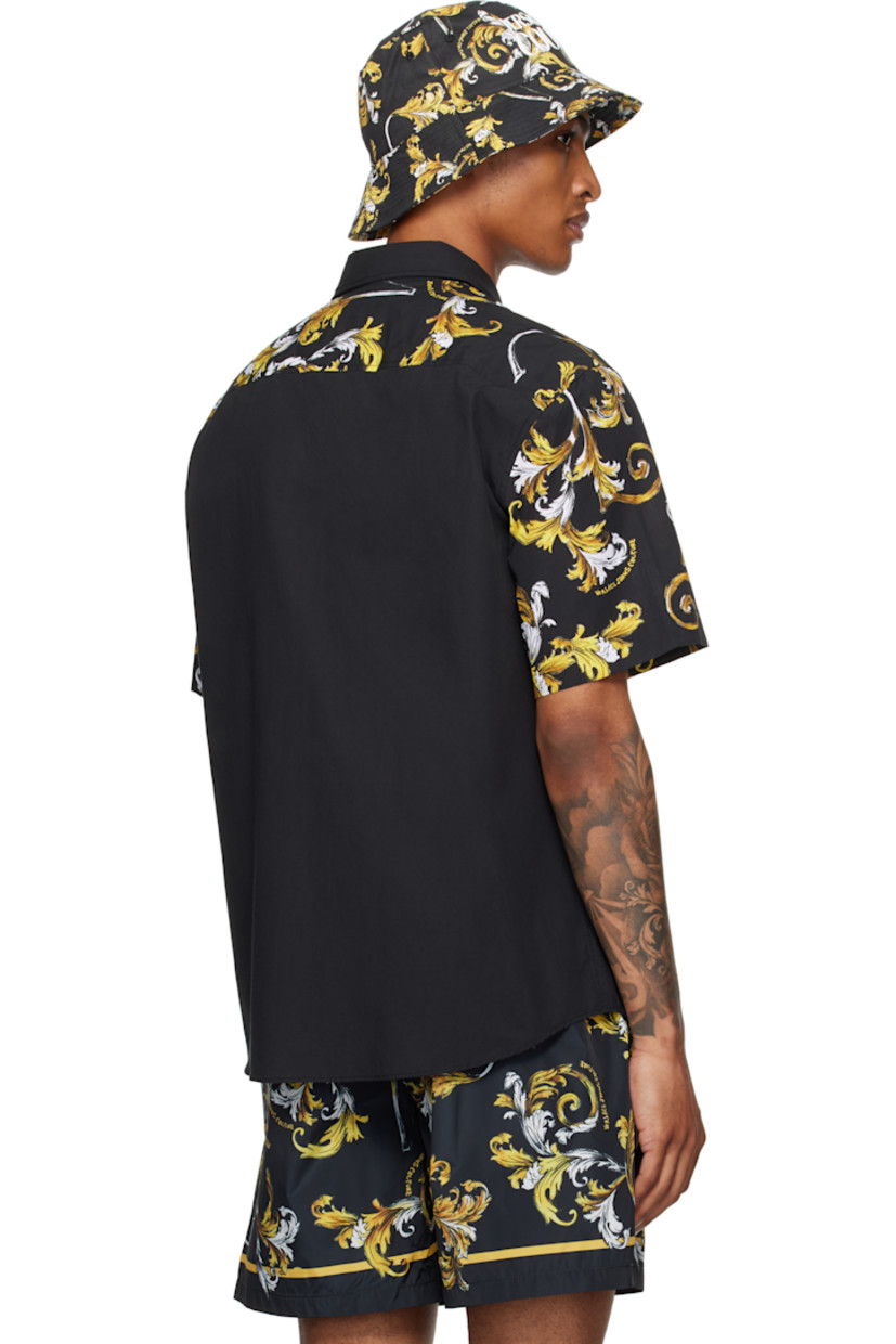 Cotton poplin shirt.

· Spread collar
· Button closure
· Logo bonded at chest
· Shirttail hem
· Barocco pattern printed at sleeves and back yoke

Supplier color: Black/Gold