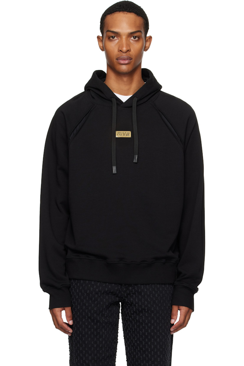 French terry hoodie.

· Drawstring at hood
· Logo plaque at chest
· Rib-knit hem and cuffs
· Raglan sleeves
· Barocco pattern printed at armscyes

Supplier color: Black