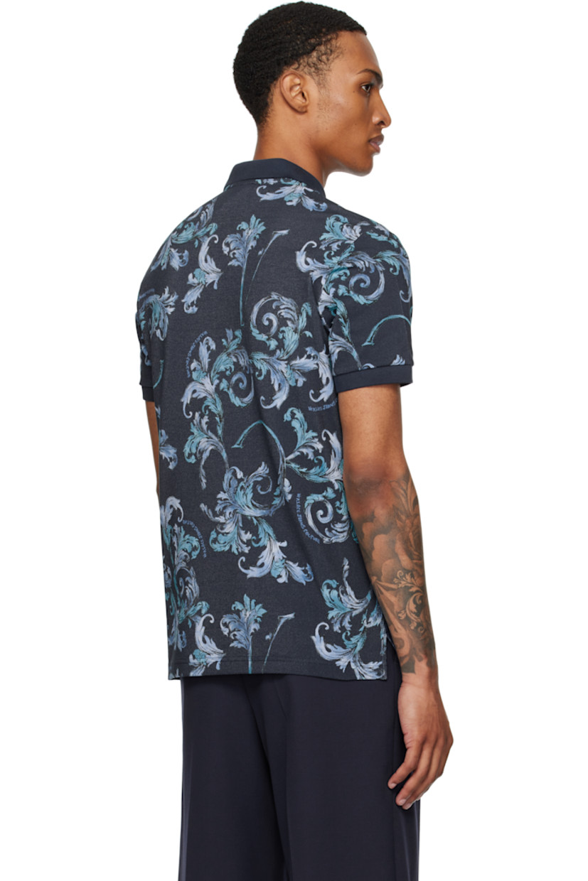 Cotton piqué polo.

· Barocco pattern printed throughout
· Rib-knit spread collar and cuffs
· Three-button placket
· Tennis-tail hem

Supplier color: Ocean