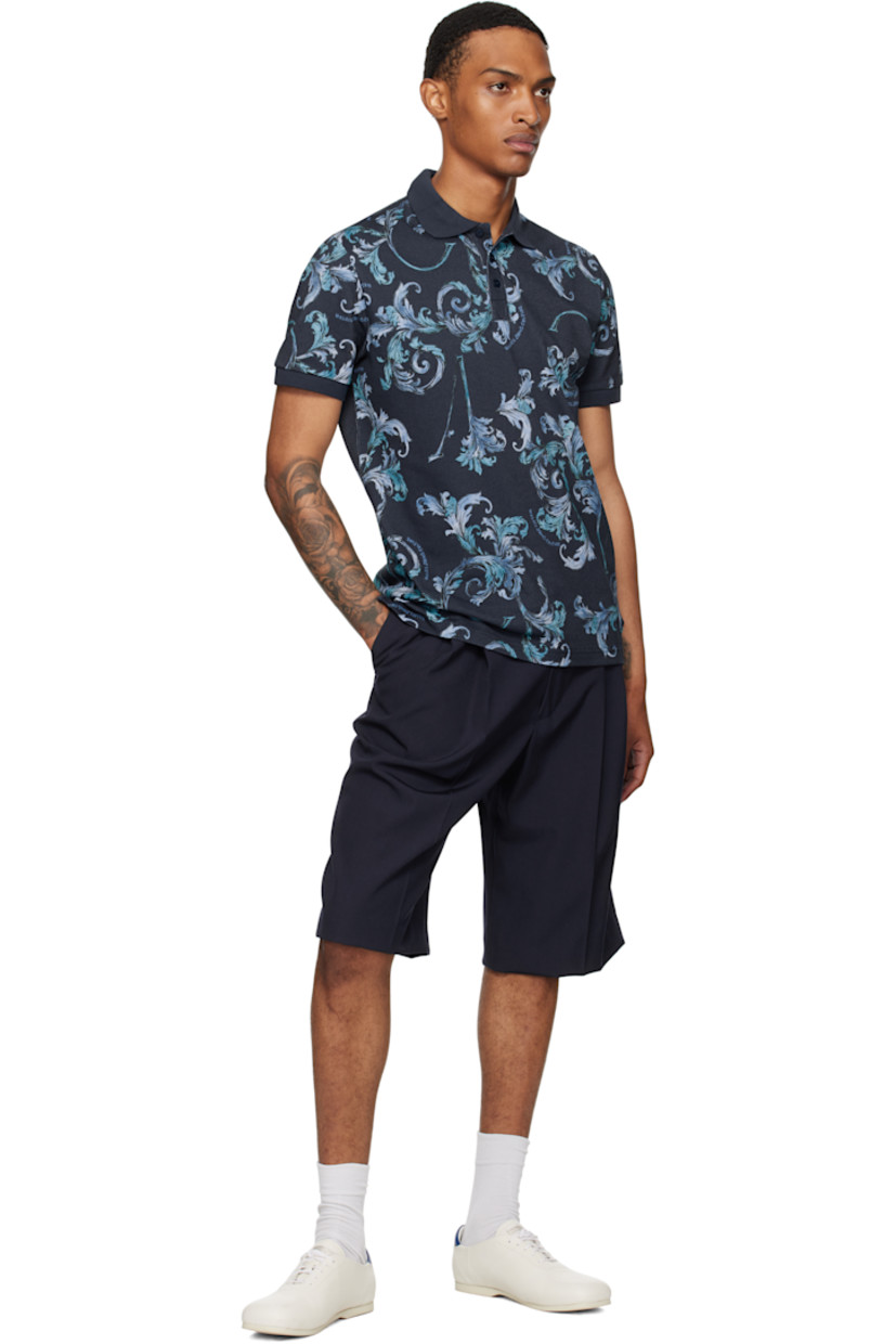 Cotton piqué polo.

· Barocco pattern printed throughout
· Rib-knit spread collar and cuffs
· Three-button placket
· Tennis-tail hem

Supplier color: Ocean